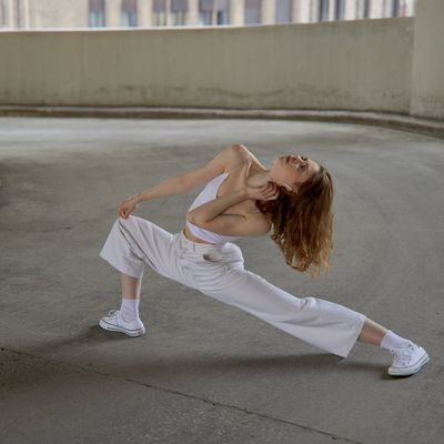 Blurred motion of a person performing a stretching exercise